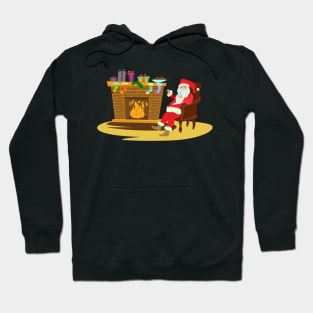 Santa sitting by fireplace drinking Hoodie